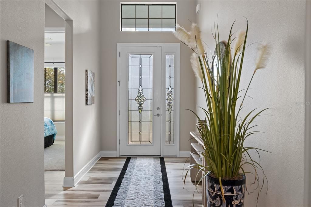 The upgraded lead glass entry door and sidelight brighten the foyer and add a classic touch.