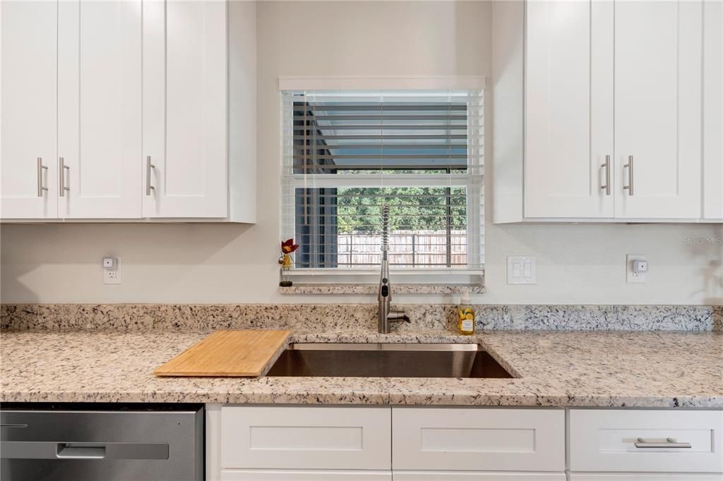 kitchen window overlooking backyard