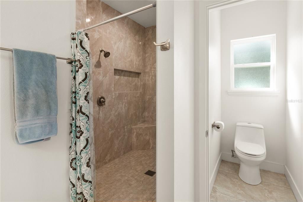 primary bathroom shower and water closet