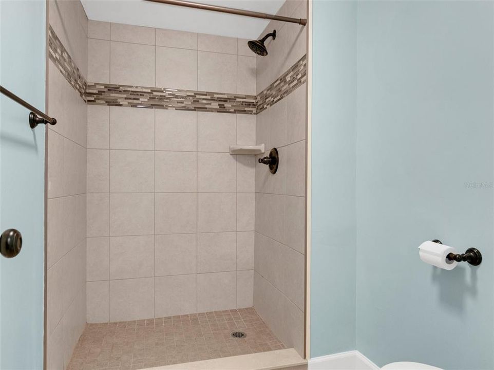 Primary shower with upgraded tile and faucets