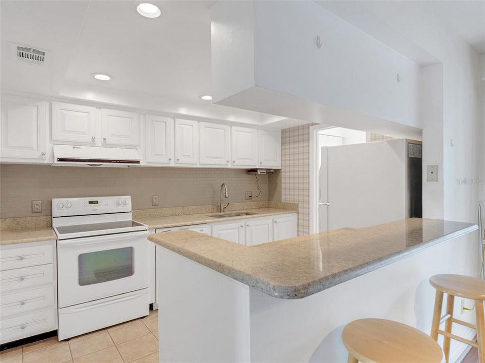 Upgraded White kitchen with granite counter top