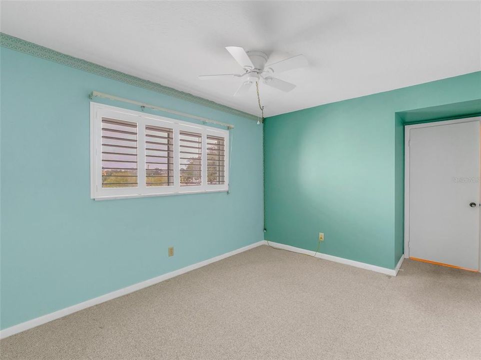 Second bedroom with plantation shutters