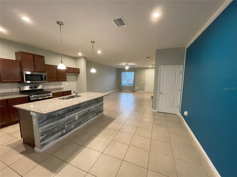 Open Concept - Custom backsplash and wood planking on island