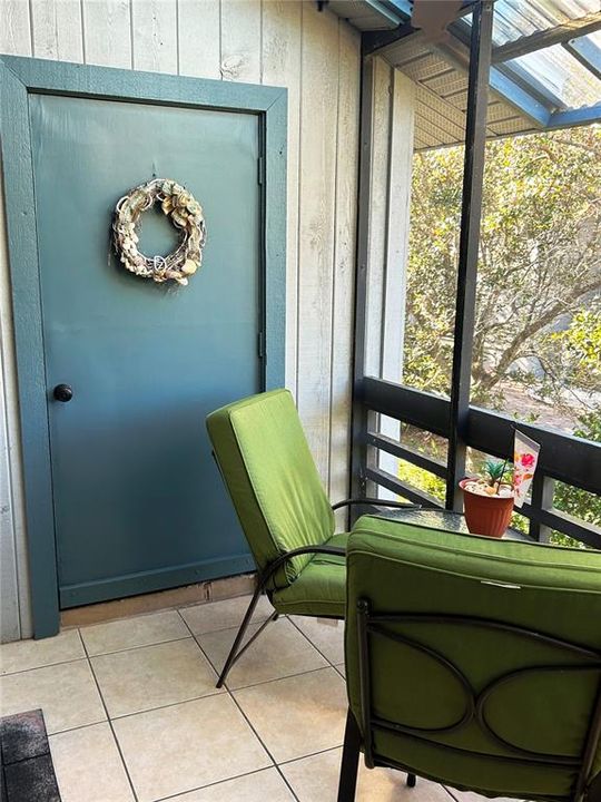 Back covered & screened patio w/storage room