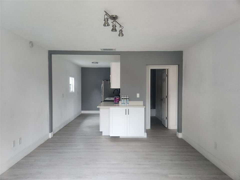 New flooring throughout this home, new 5 1/4" baseboards, new lighting.