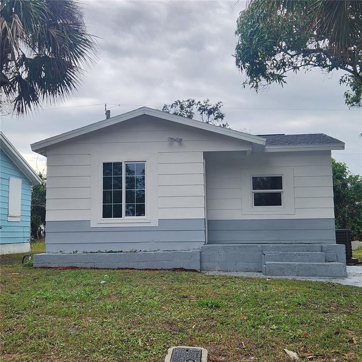 Picture perfect home sits on a large elevated lot. Outdoor lighting has also been added.