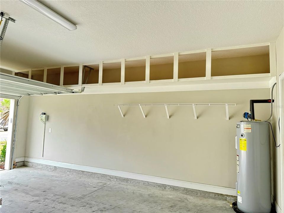 Garage with so much storage and pull down stairs to attic storage