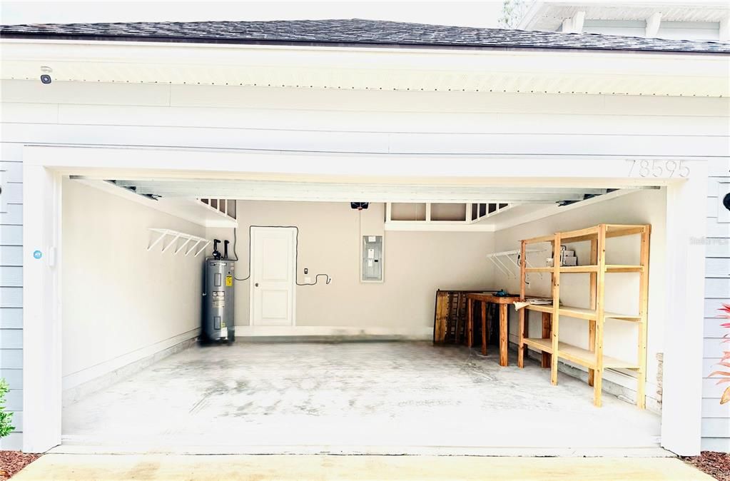 Garage with so much storage and pull down stairs to attic storage