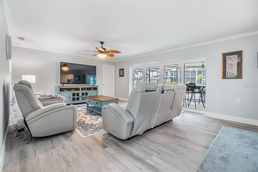 Bright and inviting, this spacious living room is perfect for relaxation or entertaining. Featuring sleek laminate wood flooring, large Sliding doors with abundant natural light.