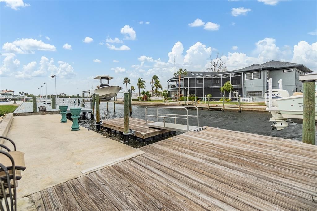 Experience waterfront living at its finest with this private dock offering direct canal access. Perfect for boating enthusiasts, the dock provides ample space for your vessel and a serene spot to enjoy breathtaking water views. Whether relaxing by the water or setting out for a day on the Gulf, this dock enhances the coastal lifestyle this property offers.