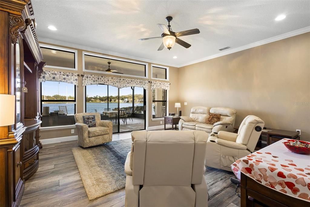 Family room towards screened lanai and porch area that overlooks Quail Lake.