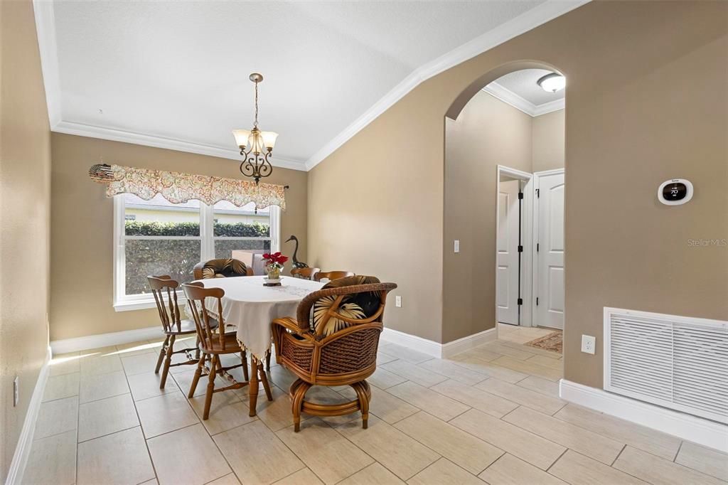 Dining area. 4th bedroom at immediate left. Garage and laundry room at right.