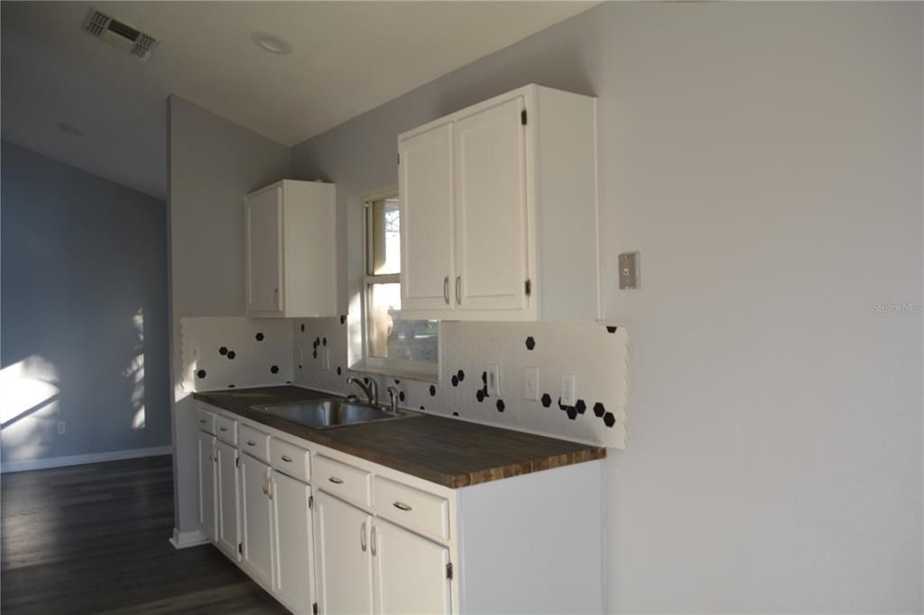 View of the kitchen looking into the formal dining room