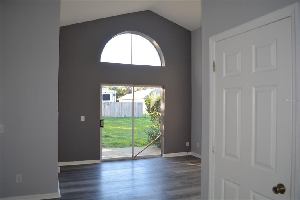 Open living room and high ceilings with new flooring throughout the house