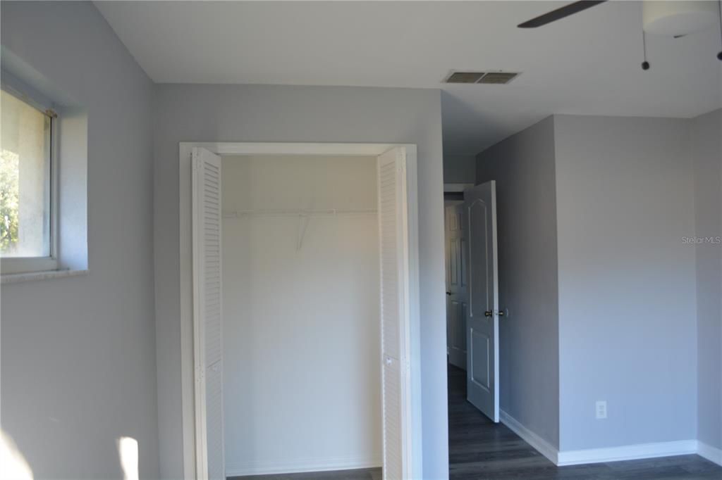 Double closet in the primary bedroom with very nice lighting