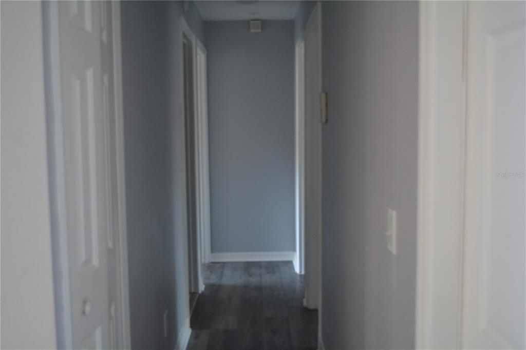 Hallway leading to the three bedrooms