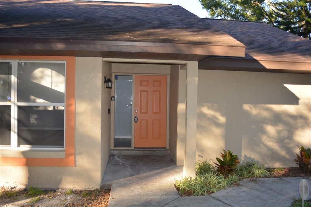 Front entry way with sidewalk leading to the front door