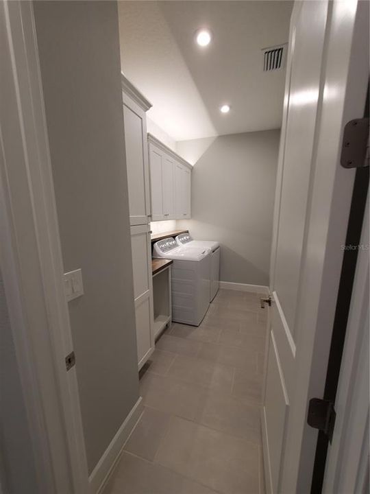 Laundry Room with Utility Sink and Cabinets