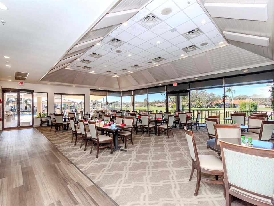 Dining room in the clubhouse with views of the pool and golf course