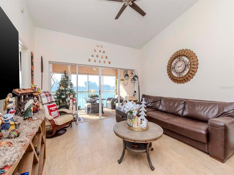 Great room opens out to the covered, screened porch