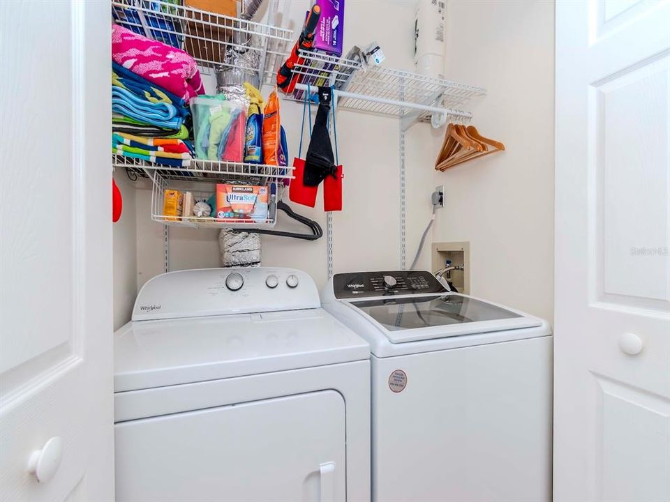 A laundry closet helps separate the bedrooms