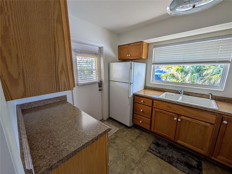 There is a door from the kitchen to the covered carport. No carrying groceries through the rain to the front porch.