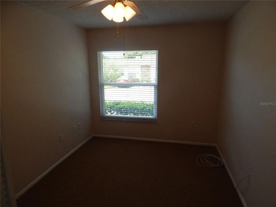 2nd Bedroom, window view of exterior front.