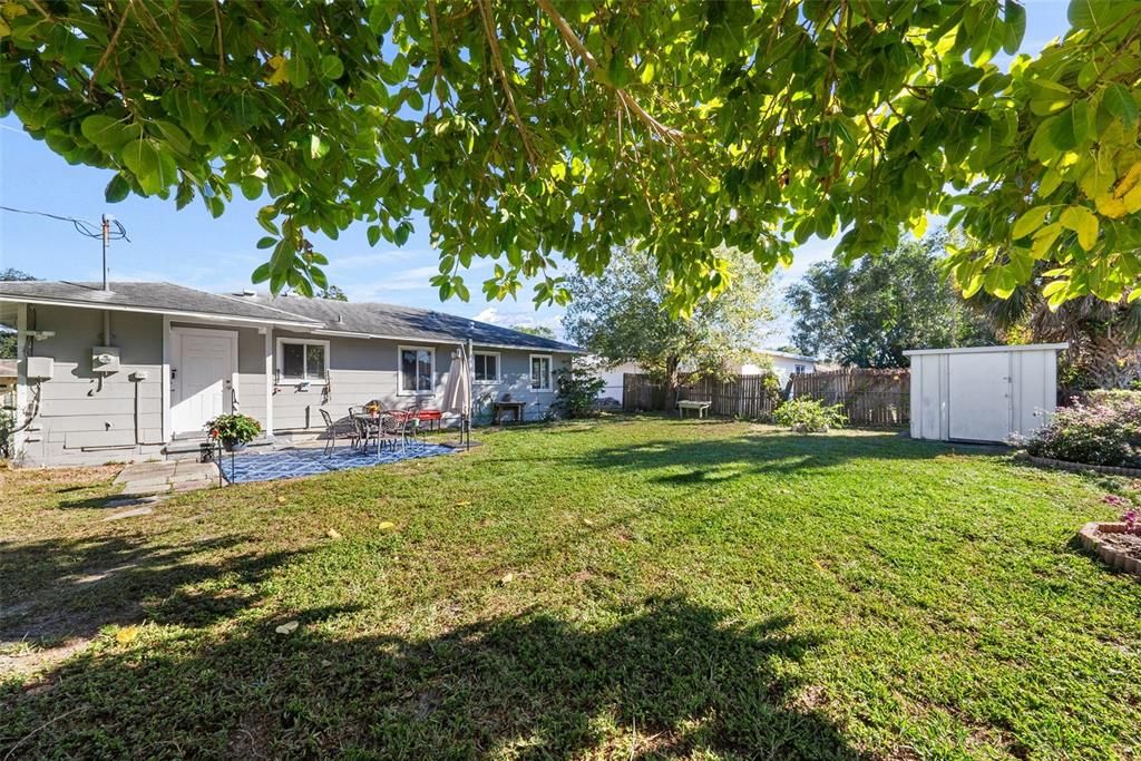 Fully fenced backyard complete with storage shed, and ample space for a pool....