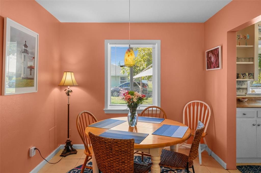 Tile Dining Room with art glass pendant overlooking the backyard