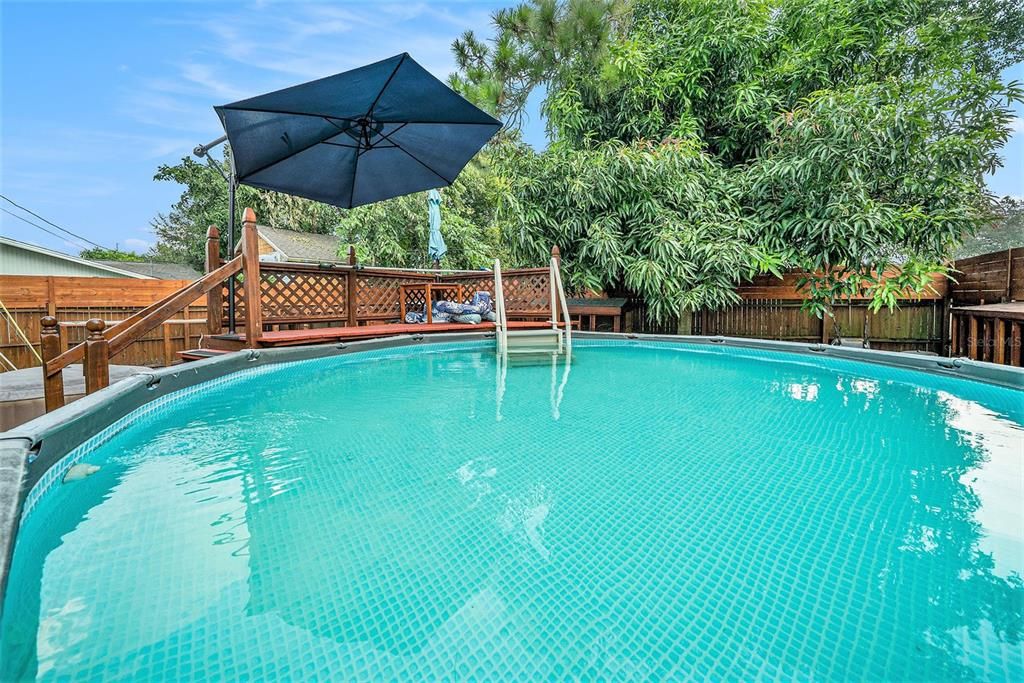 Above-ground saltwater POOLand HOT TUB, completed with awrap-around DECK.