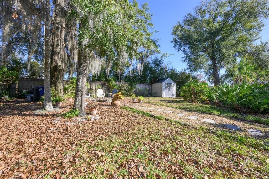 View of backyard. Home comes with the shed.