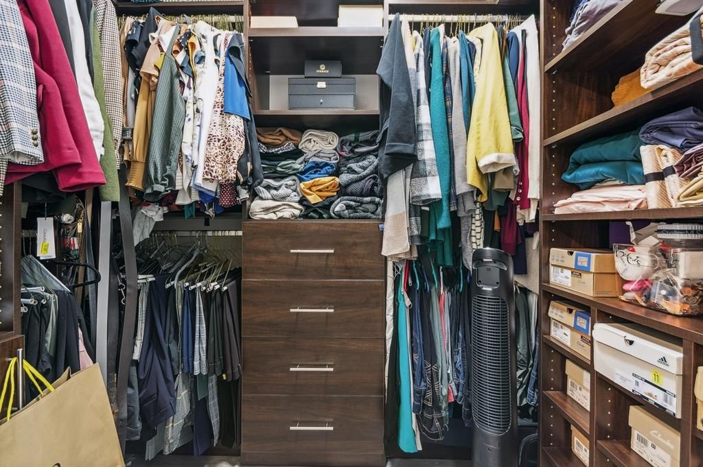 One of Two large walk-in closets with custom built-ins