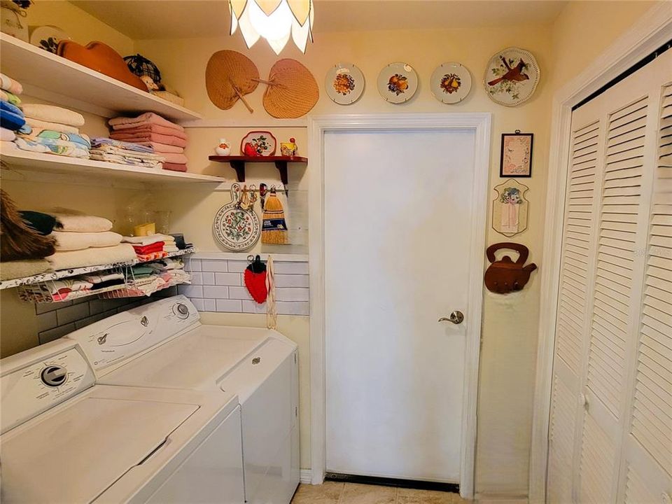 Lots of storage in the inside laundry room, leading to the garage