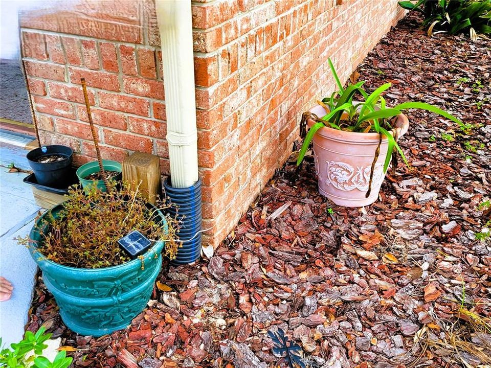 Downspouts drain directly into the undergroung french drain to keep the home dry