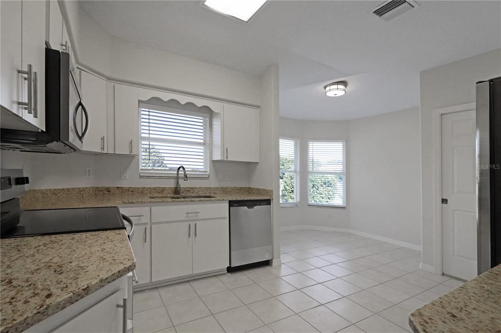 Kitchen with granite countertops and new appliances