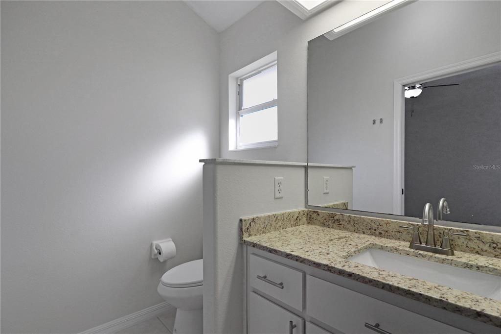 Ensuite bath also has a granite countertop