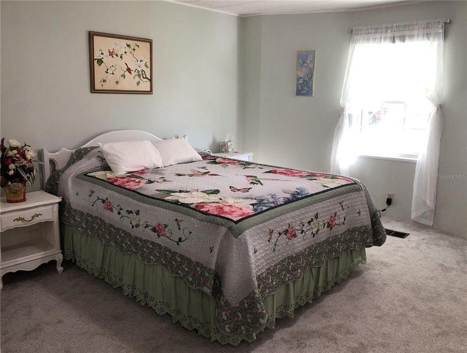 Primary bedroom with large window