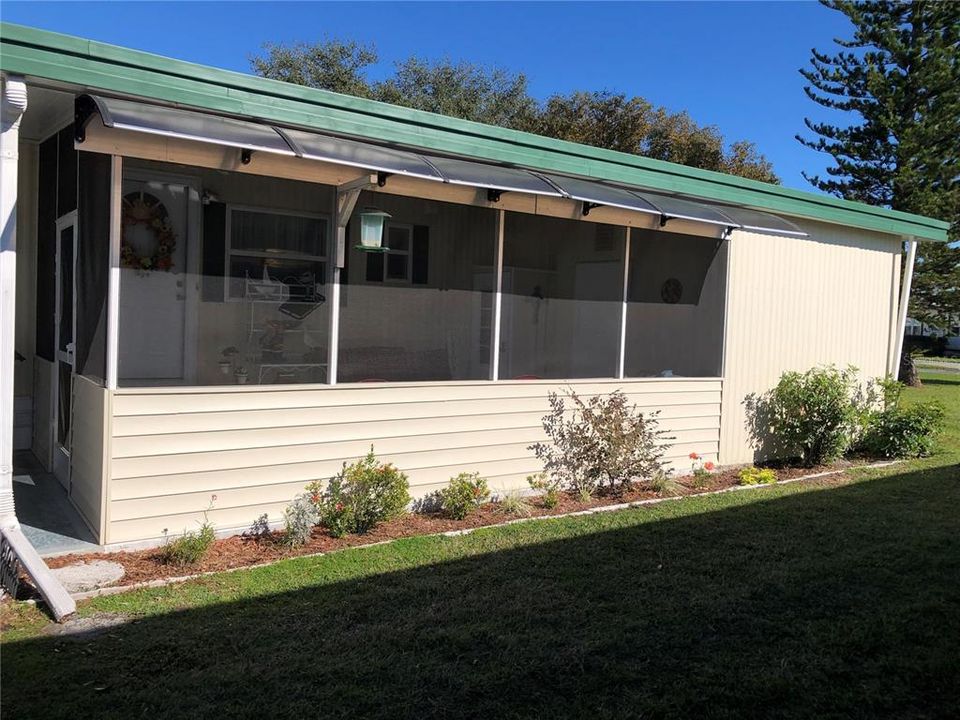 Exterior of screened porch area on side of home