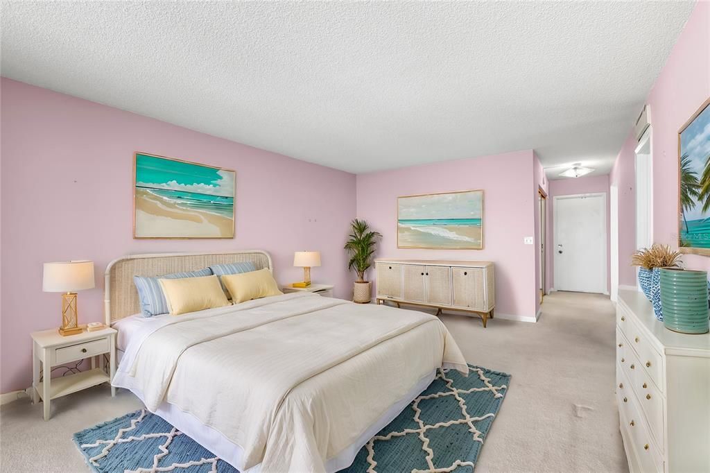 Primary bedroom suite features a huge walk-in closet and en suite bath. Virtual Staging