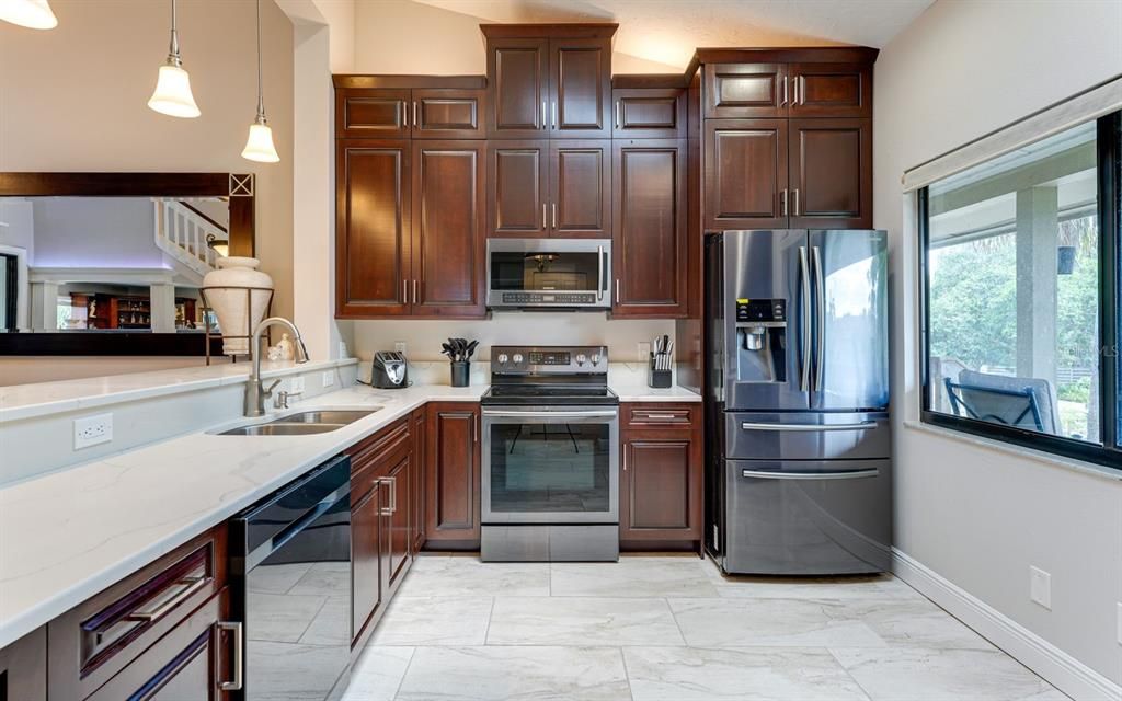 Quality Kitchen with Stainless Appliances and Quartz Tops