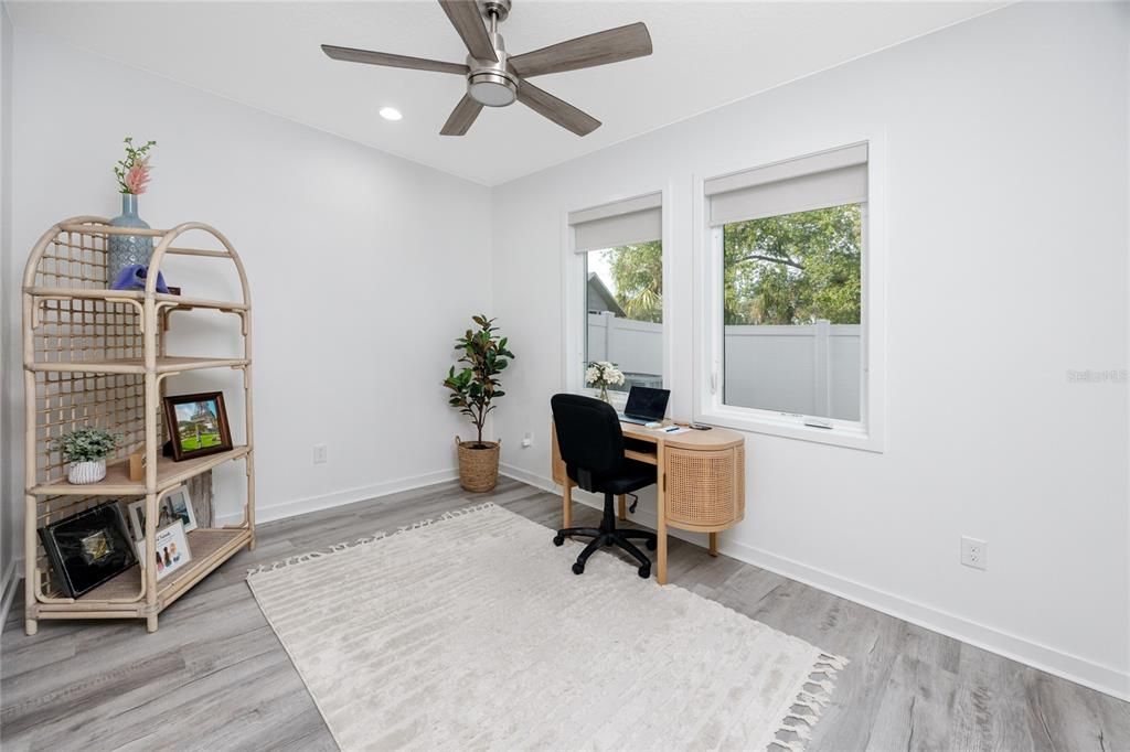 Downstairs bedroom/office with closet.