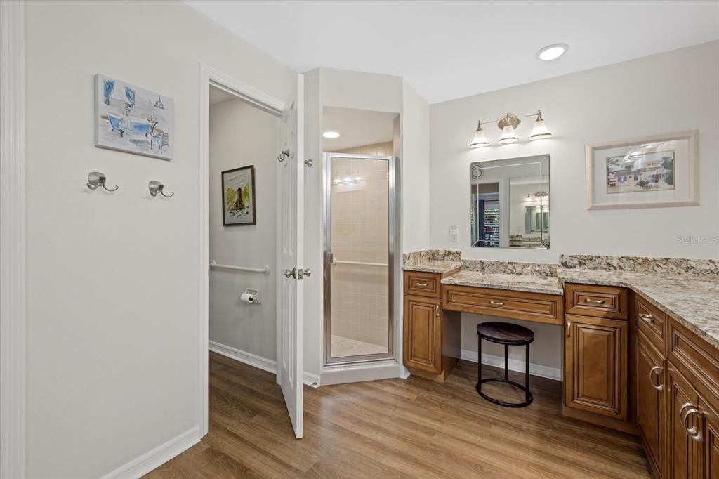 Enjoy the convenience of a built-in vanity, featuring mirror and lighting and ample counter space for your morning routine.