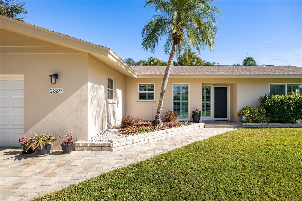 Gorgeous paver stones lead you from the street right up to the front door.