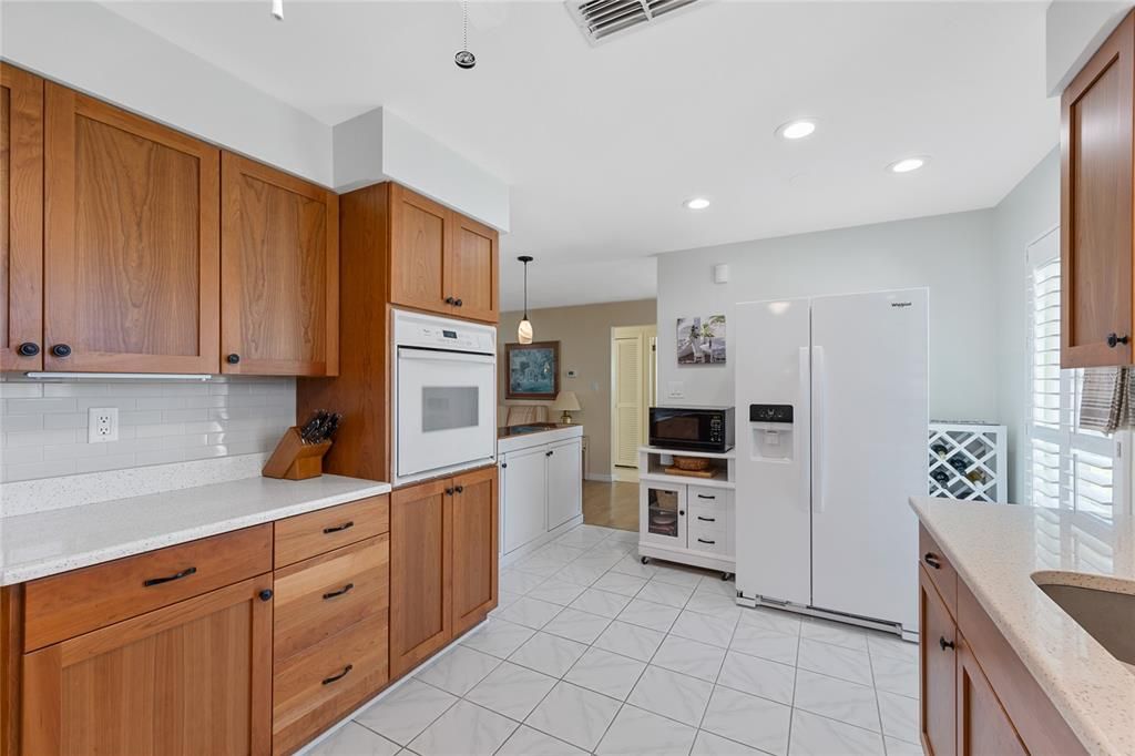 The kitchen is light and bright with recessed/can lights and large windows with plantation shutters so you can control just how much natural light you want to come in.