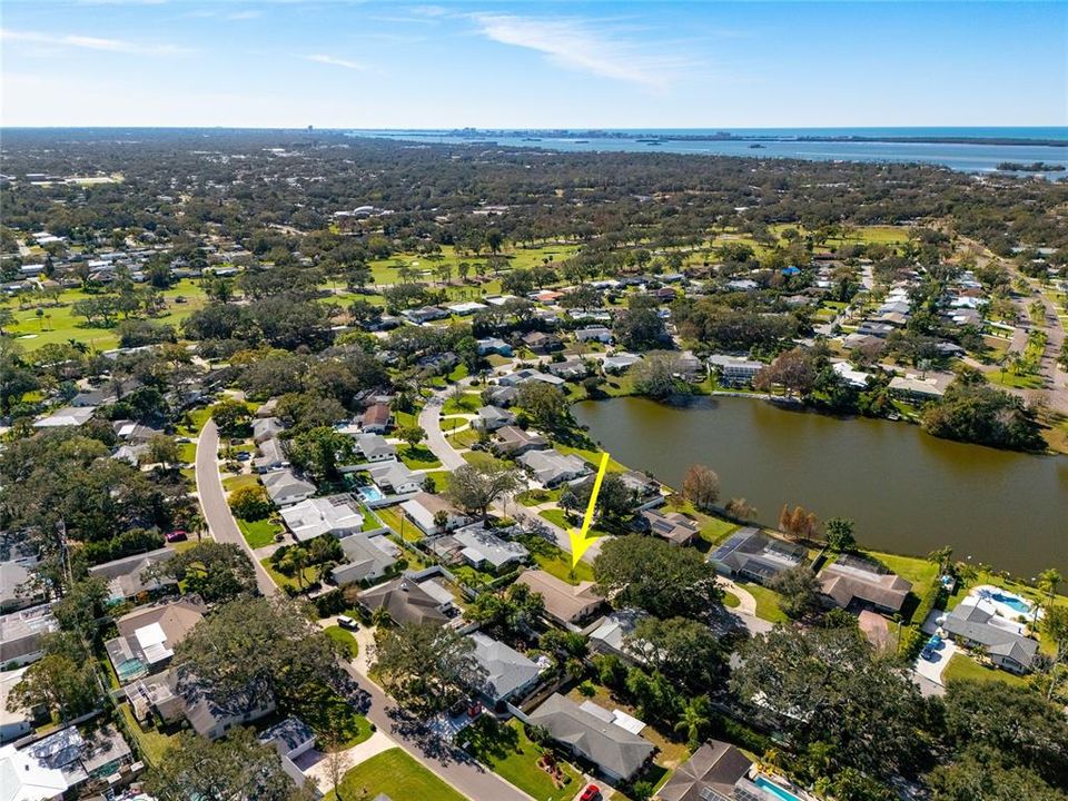 This aerial image shows the proximity to the Dunedin Golf Club (front 9 in this image) as well as community owned Lake Saundra.