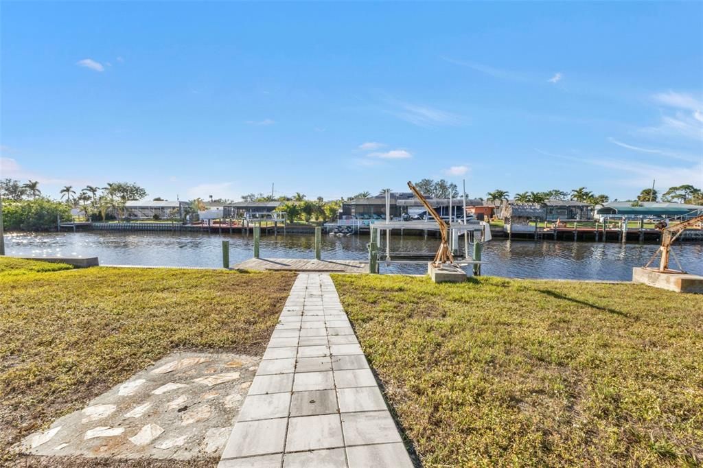 Paved walkway to the dock and boat lift