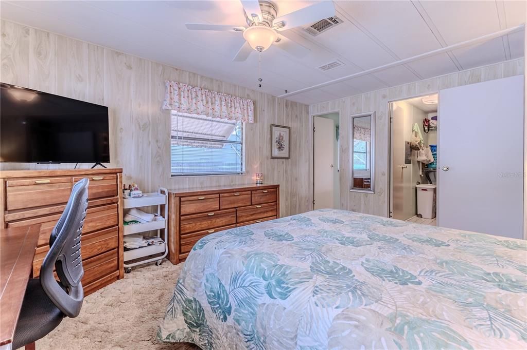 Primary bedroom with walk in closet and bathroom