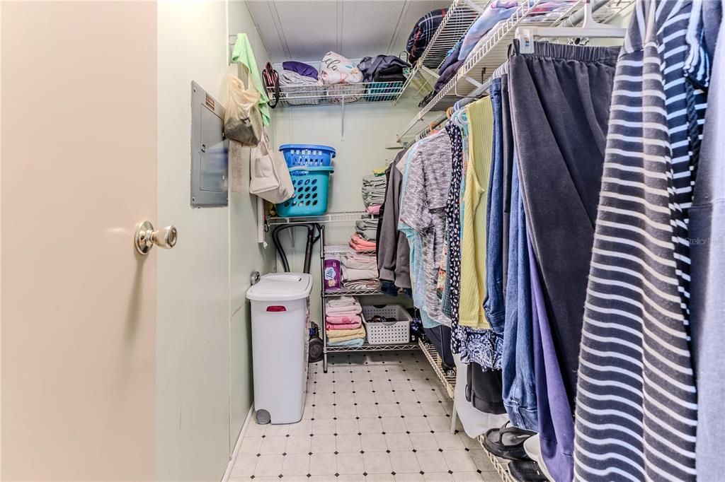 Primary bedroom walk in closet