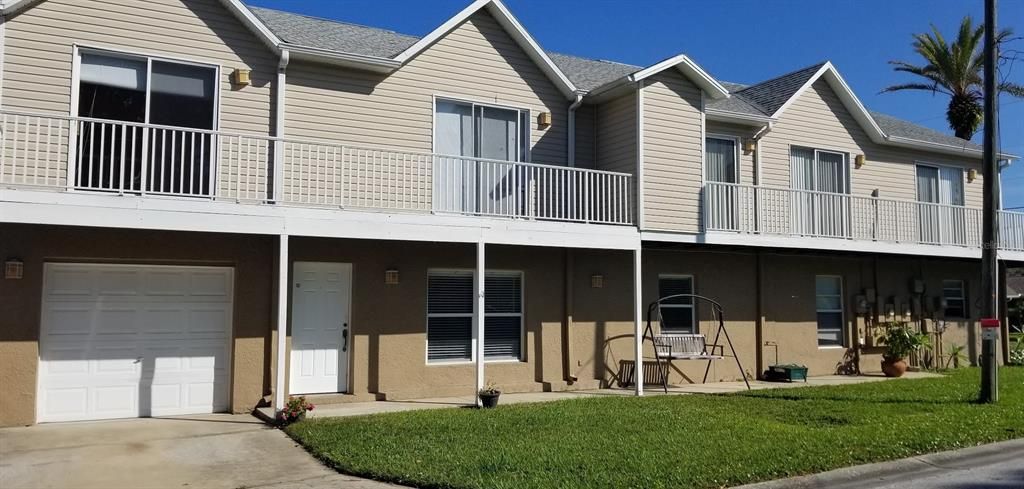 Townhome, end unit with garage and second story balconies