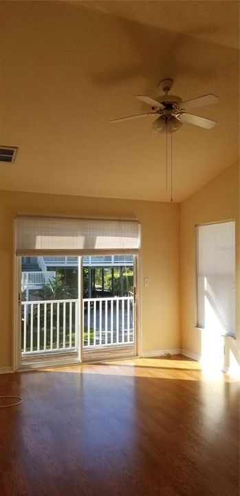 Upstairs bedroom with private balcony and cathedral ceilings